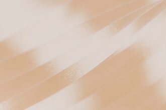 A blurry photo of a person holding a cell phone